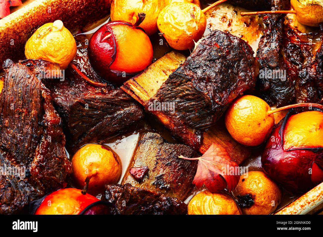 Beef ribs roasted in plums and pears.Meat ribs stewed in fruit sauce