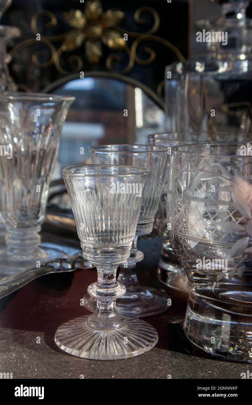 Glass crystal vintage goblets in the window of an antique shop selling