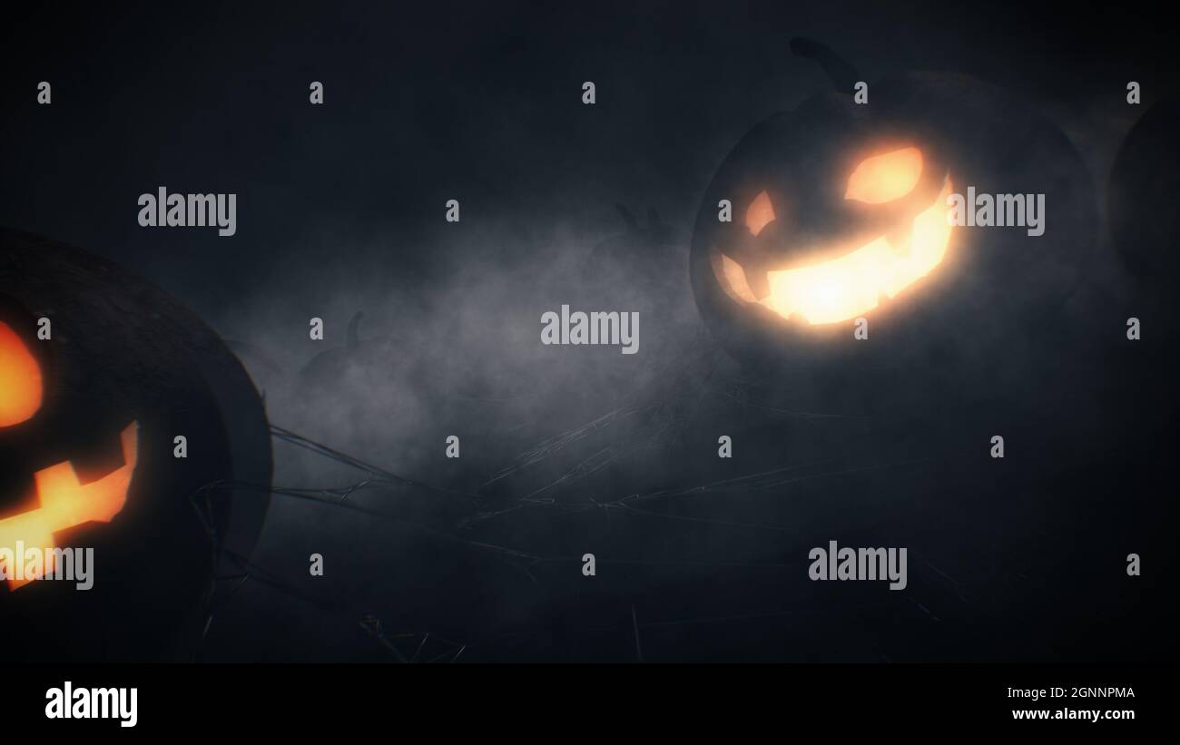 Jack o lantern pumpkins smile and mystic fog in halloween dark night ...