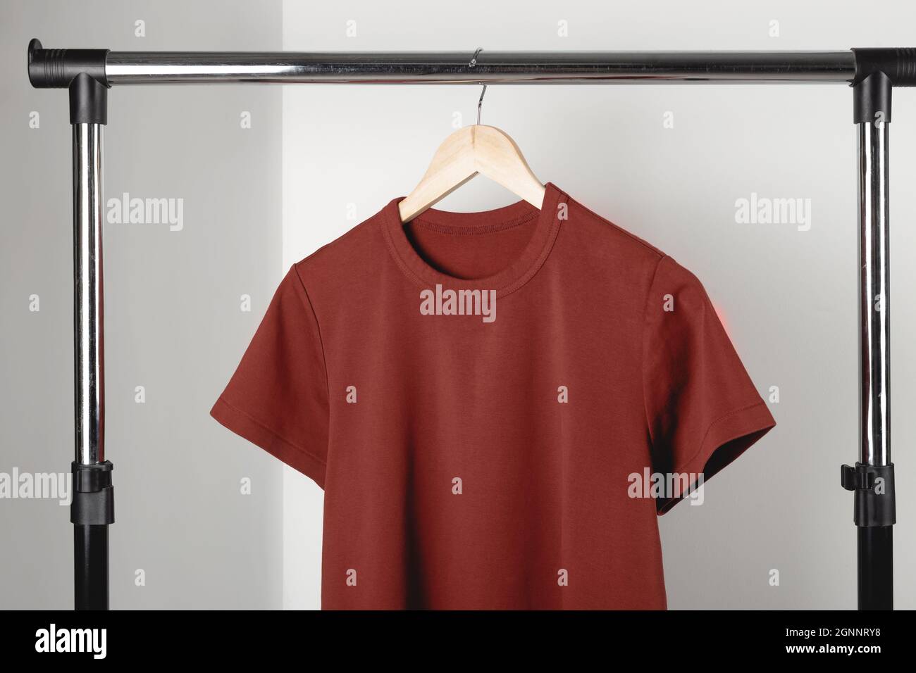 https://c8.alamy.com/comp/2GNNRY8/blank-red-burgundy-t-shirt-mockup-on-clothes-hanger-bella-canvas-mock-up-2GNNRY8.jpg