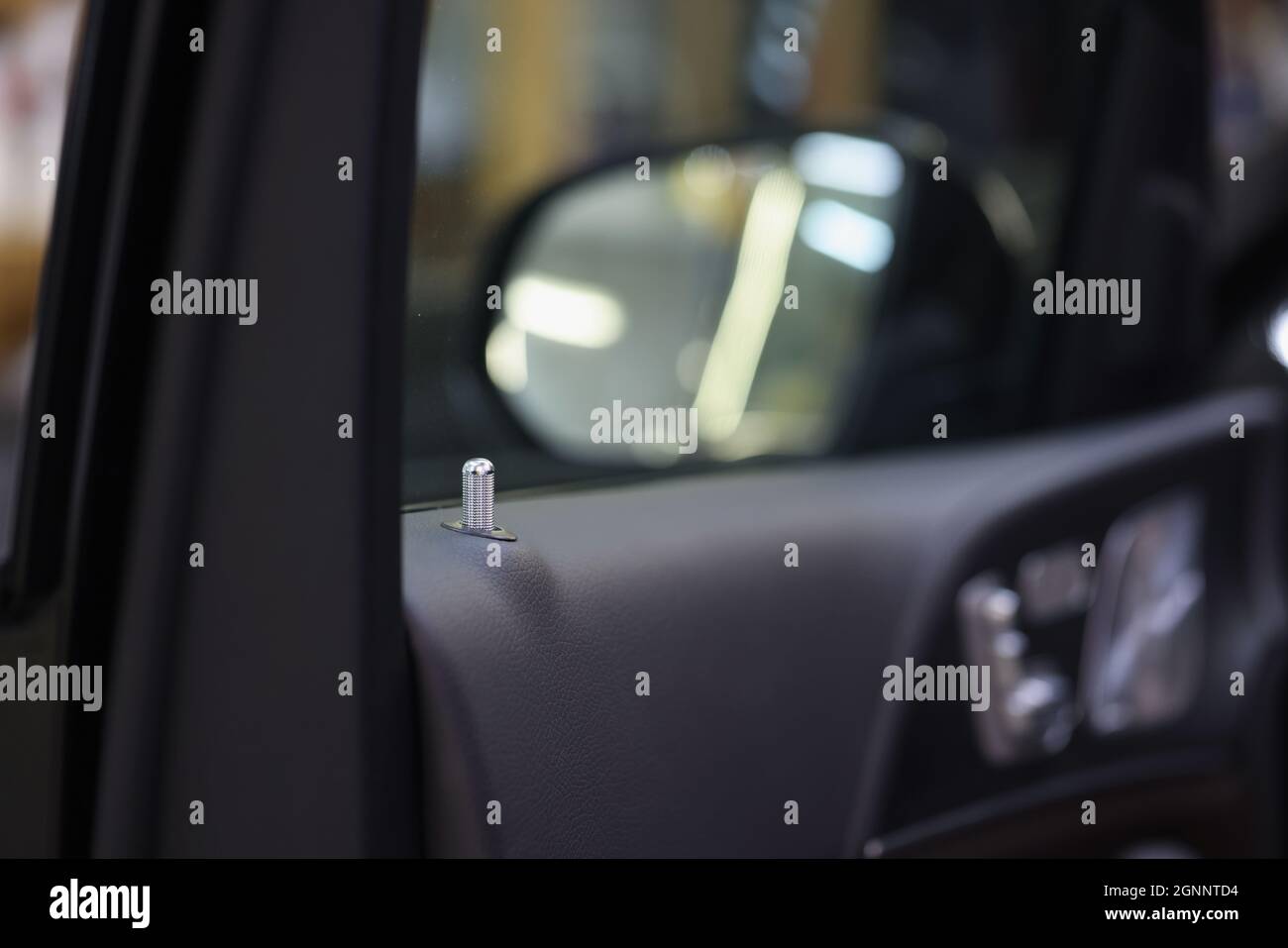 Latch for opening and closing door in passenger compartment closeup