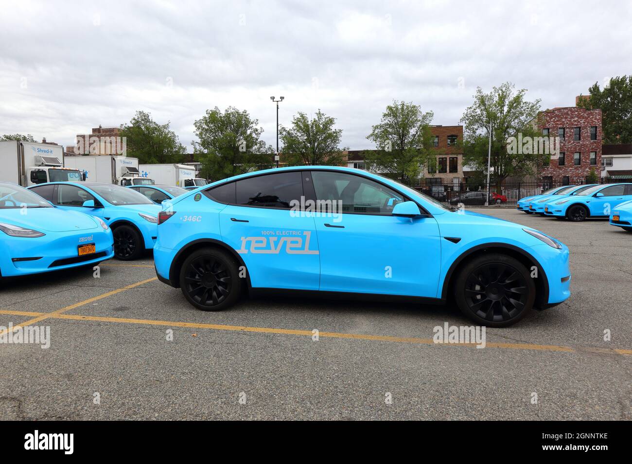 A fleet of Revel branded Tesla Model Y cars at a parking lot in Brooklyn. The fully electric fleet is the ... [see additional info for full caption]. Stock Photo