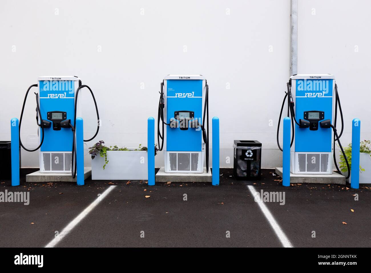 Electric chargers at Revel's superhub in Brooklyn. The EV charging station is equipped with Tritrium 75kWh ... [see additional info for full caption]. Stock Photo