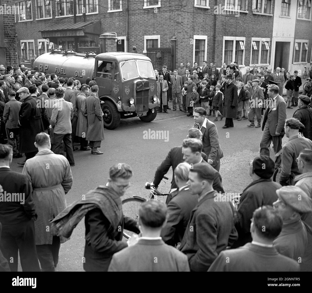 File photo dated 24/10/1953 of Army driver at the wheel of a tanker carrying fuel oil leaving the Townmead Rd depot in Fulham, west London, to restore the distribution of petrol and oil to the London area interrupted by a strike of tanker drivers. Issue date: Monday September 17, 2021. Stock Photo