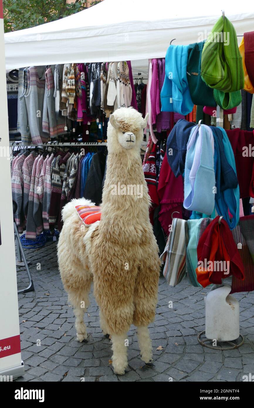 Funny toy, as customer stopper on market. Peruvian textiles to sell. Stock Photo