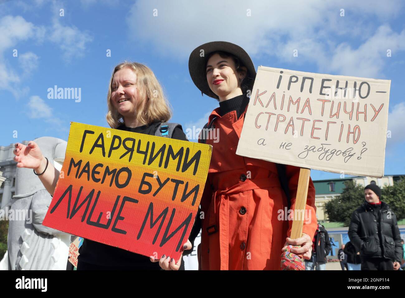 KYIV, UKRAINE - SEPTEMBER 26, 2021 - Environmental activists hold placards in Mykhailivska Square during the march urging to address climate change an Stock Photo