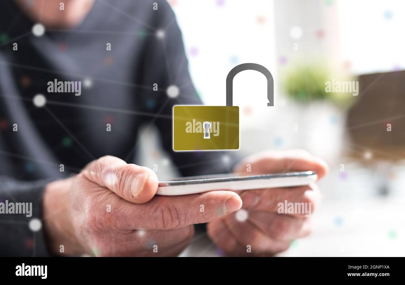 Hands of man holding a smartphone with cyber security concept Stock ...