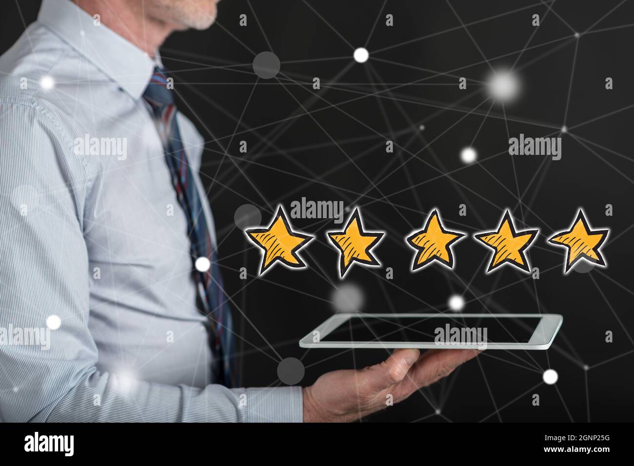 Quality concept above a tablet held by a man Stock Photo