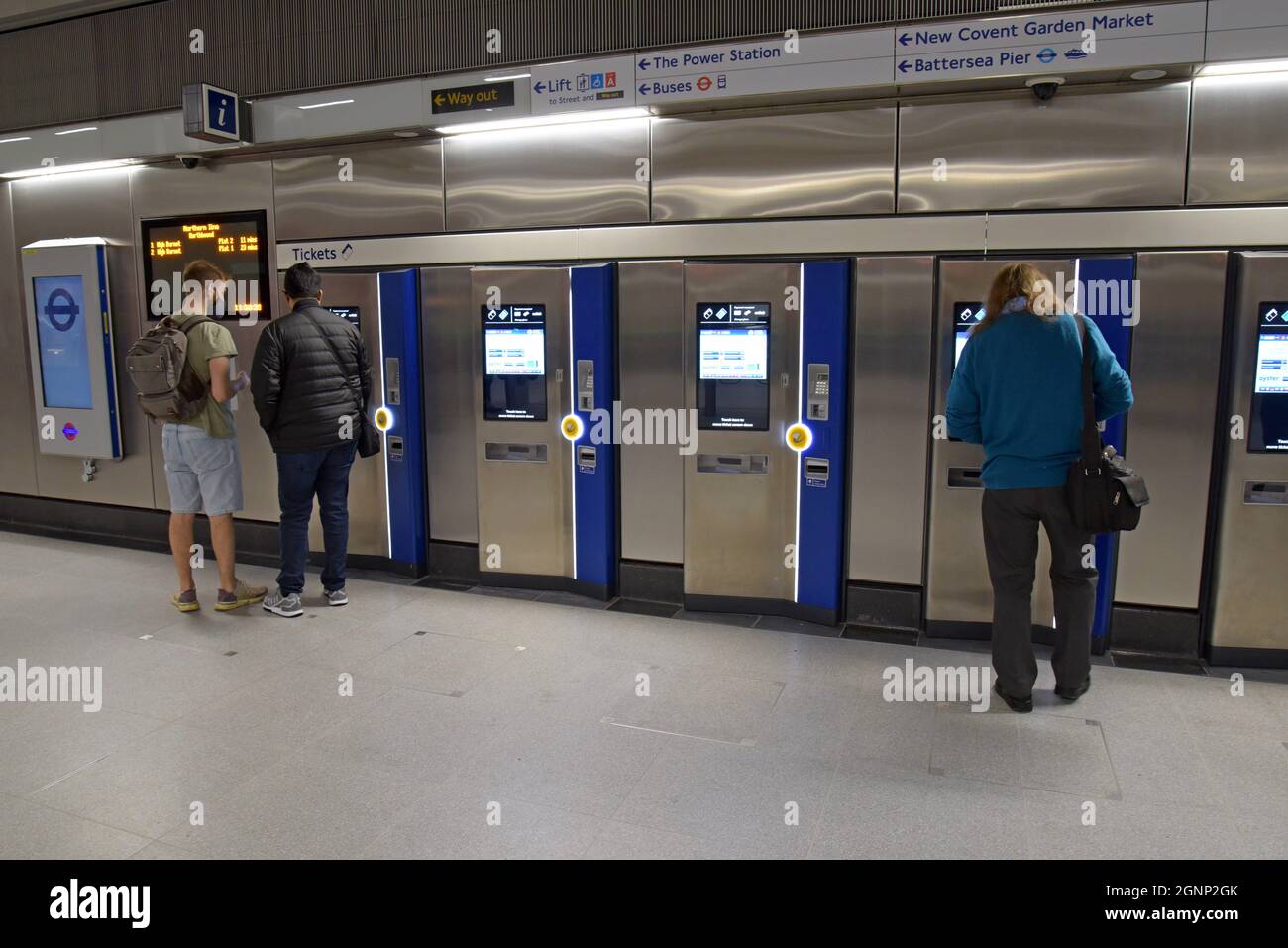 Passengers buying tickets at the new Battersea Power Station underground station on the Northern Line, on opening day, 20th September 2021 - Stock Image