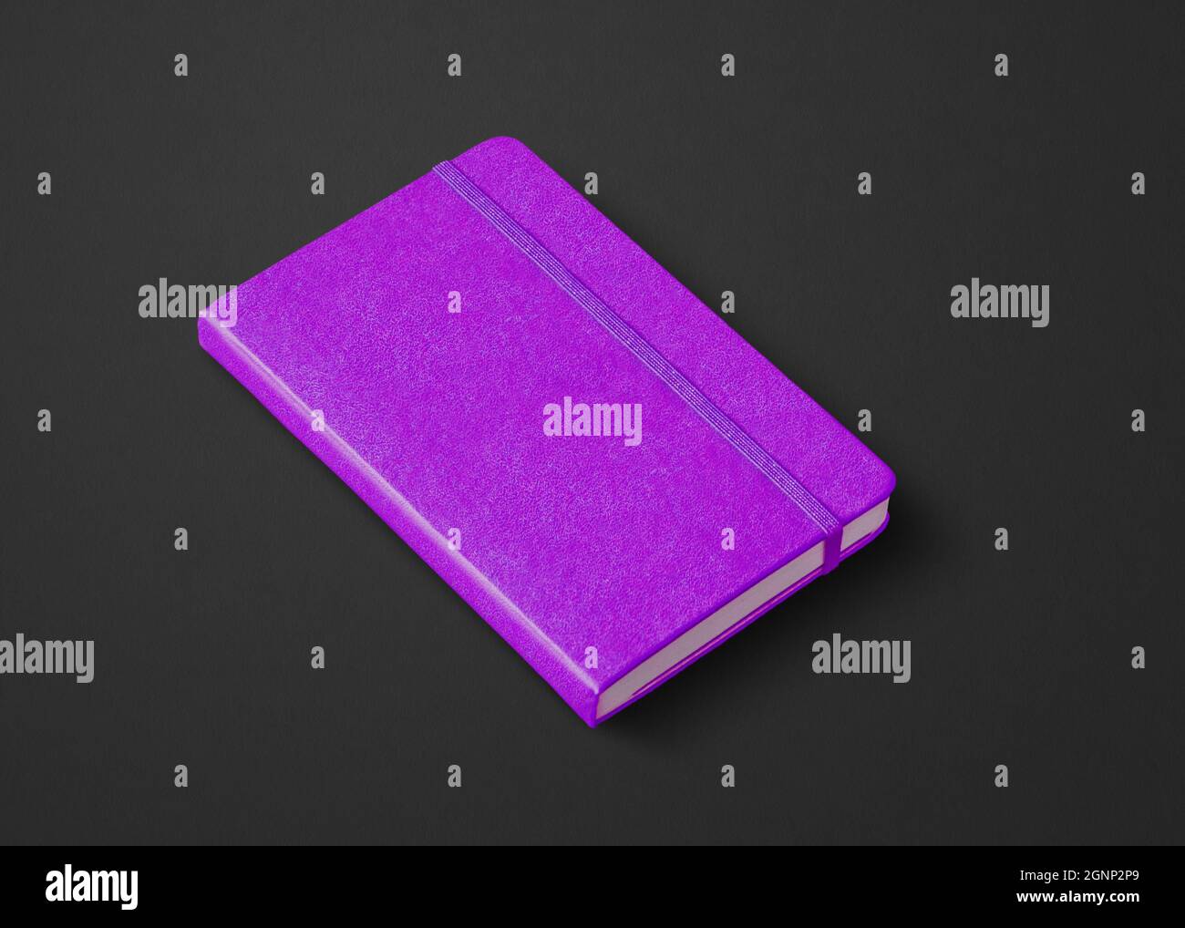 Purple closed notebook mockup isolated on black Stock Photo