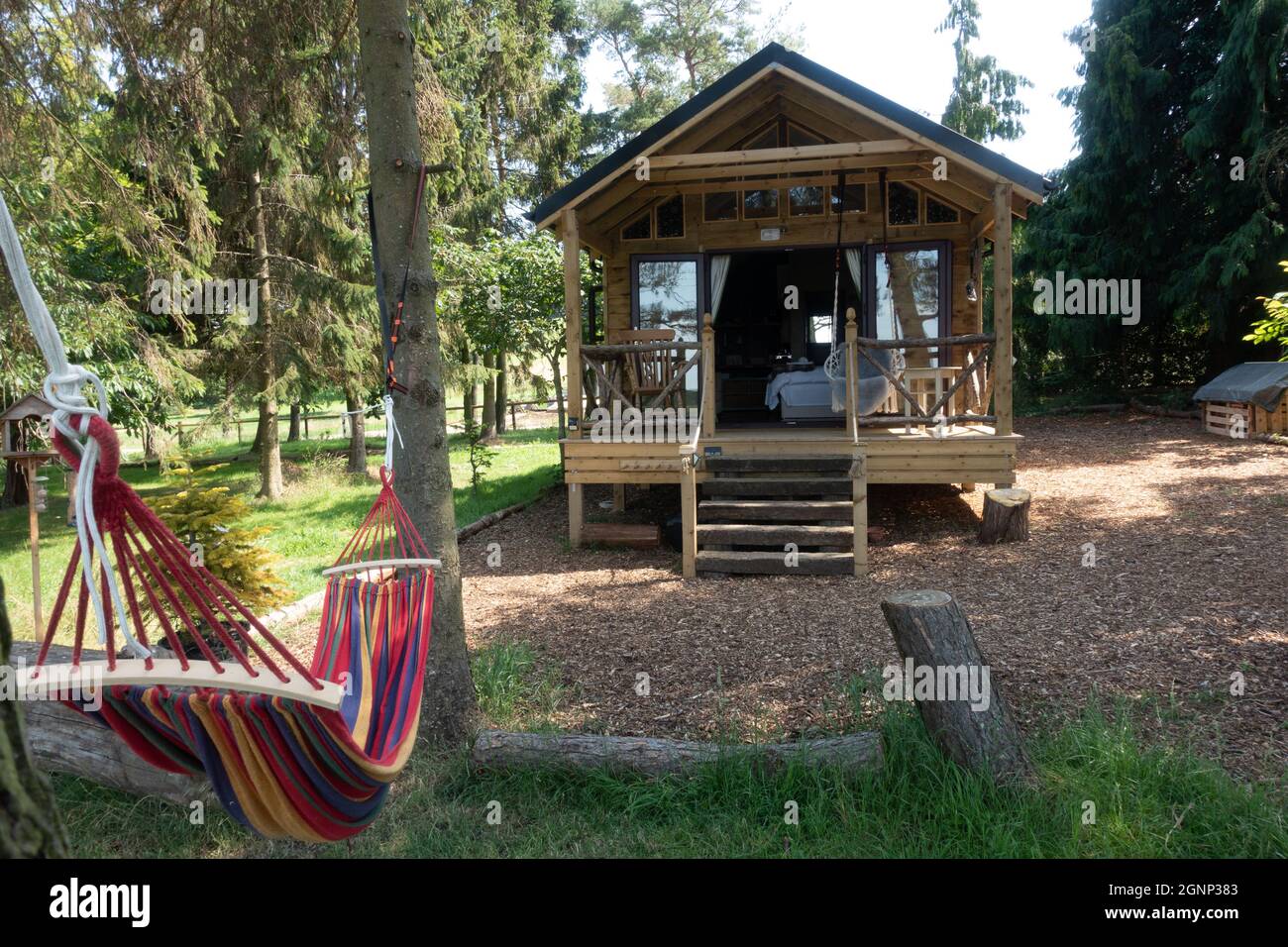 Pine Lodge timber built eco glamping cabin Cotswolds UK Stock Photo