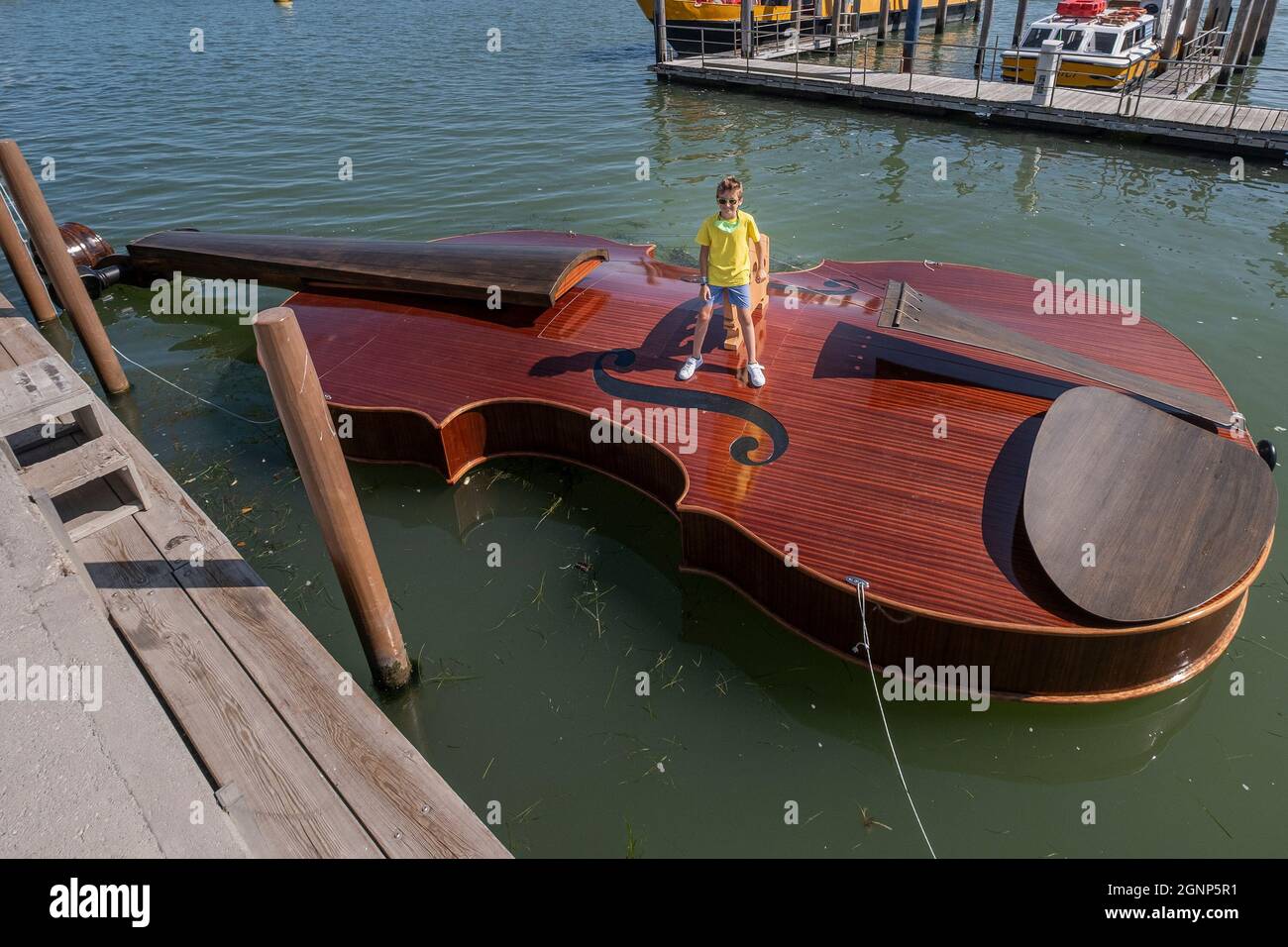 The launching of the violinshaped boat Stock Photo Alamy