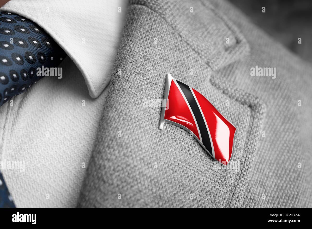 Metal badge with the flag of Trinidad and Tobago on a suit lapel Stock