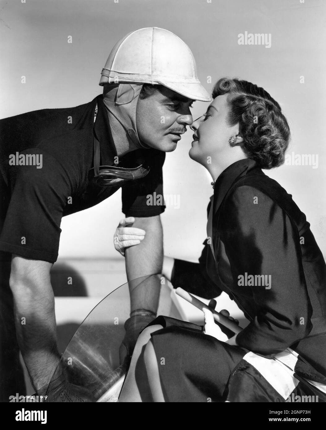 CLARK GABLE and BARBARA STANWYCK Publicity Portrait in TO PLEASE A LADY 1950 director CLARENCE BROWN story / screenplay Barré Lyndon and Marge Decker costume design Helen Rose Metro Goldwyn Mayer Stock Photo