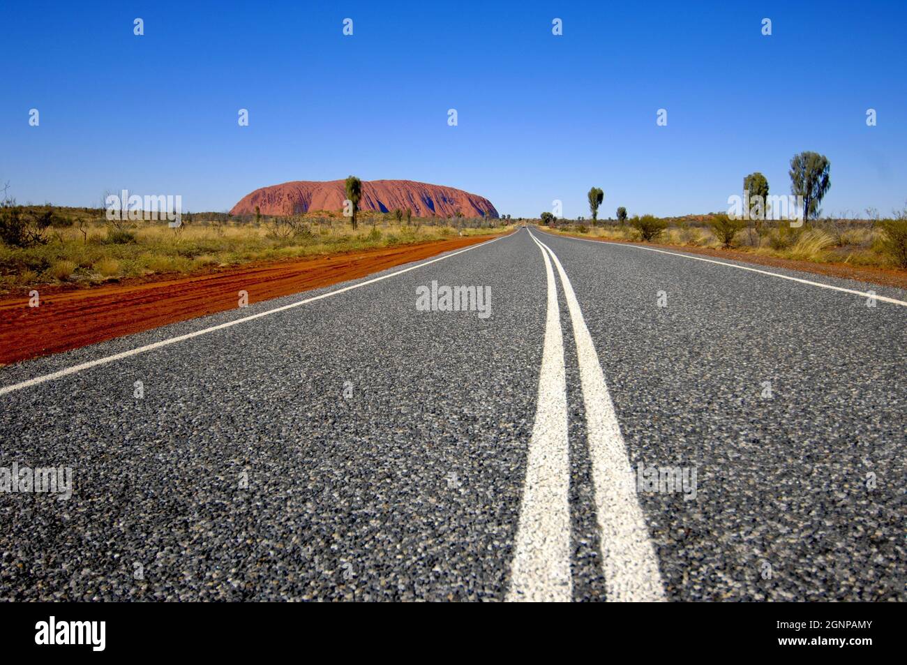 Road near the Ayers Rock, Australia, Ayers Rock Stock Photo