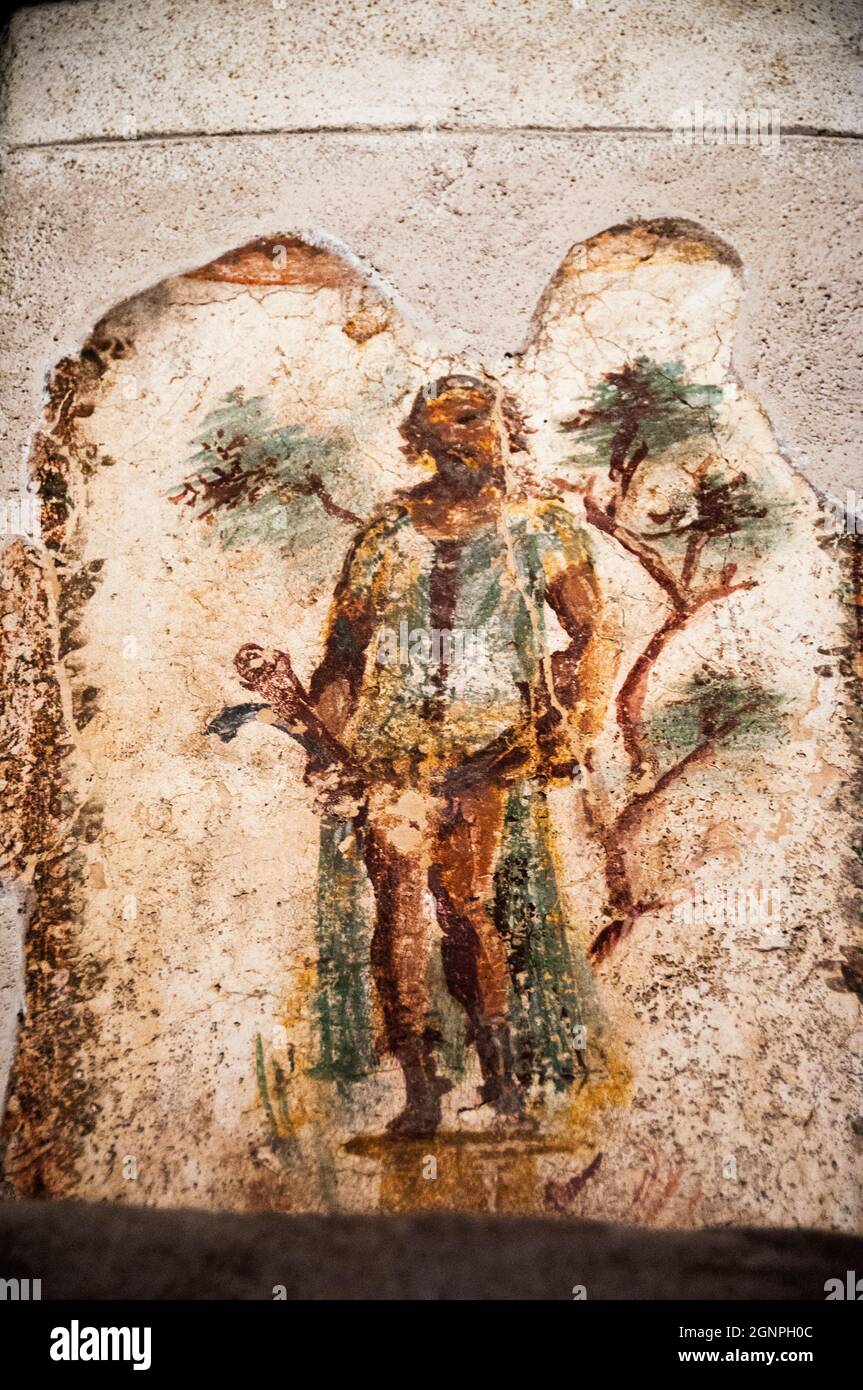 Priapus, god of the vegetable garden, with a double phallus at the Lupanar of Pompeii, the brothel of the buried city of Pompeii, Italy. Stock Photo