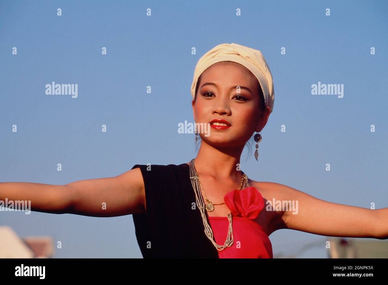 Thailand. Chiang Mai. Outdoor portrait of young woman at flower festival Stock Photo