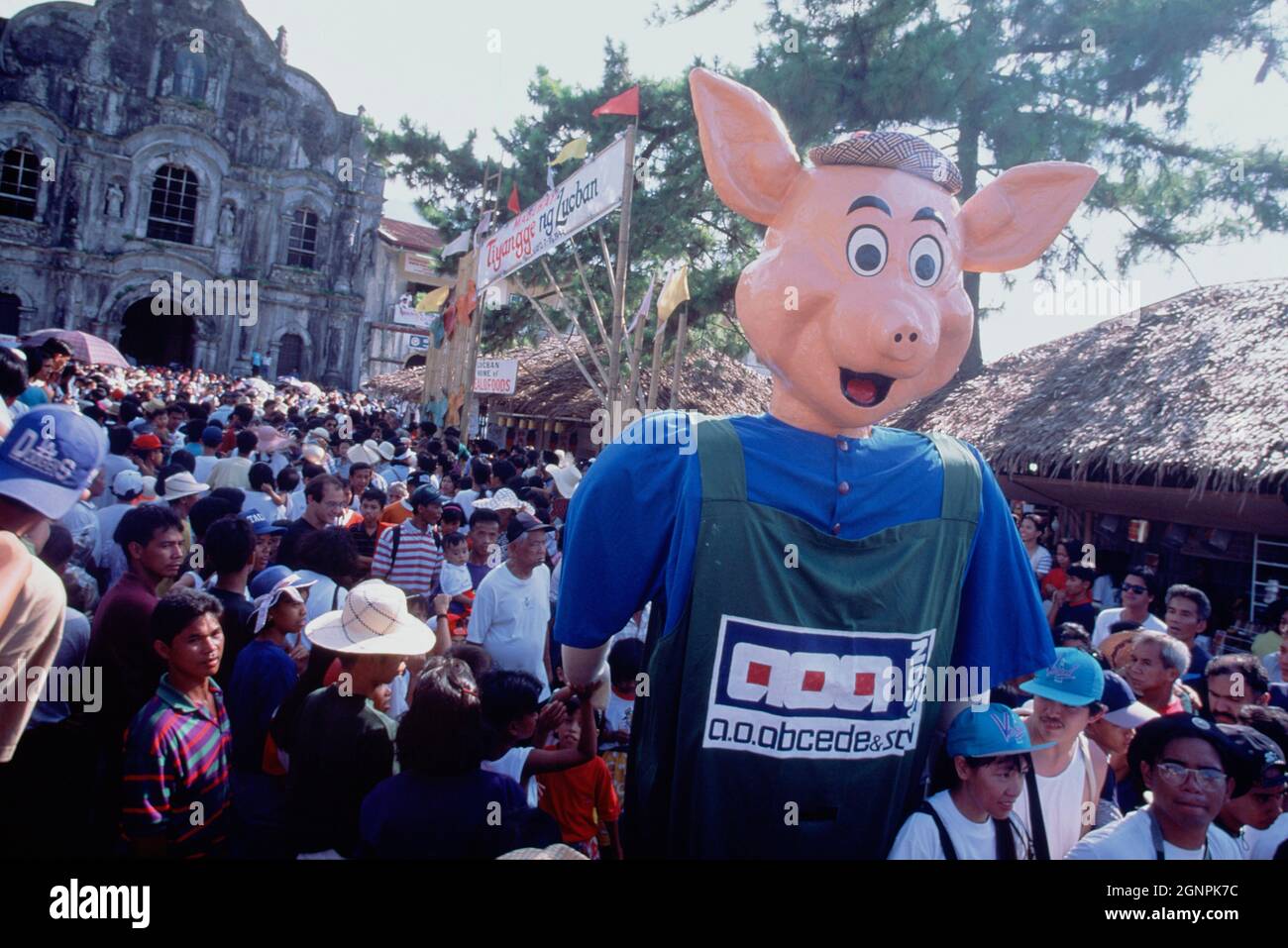 Philippines. Quezon. Pahiyas rice festival. Crowds with giant pig figure. Stock Photo