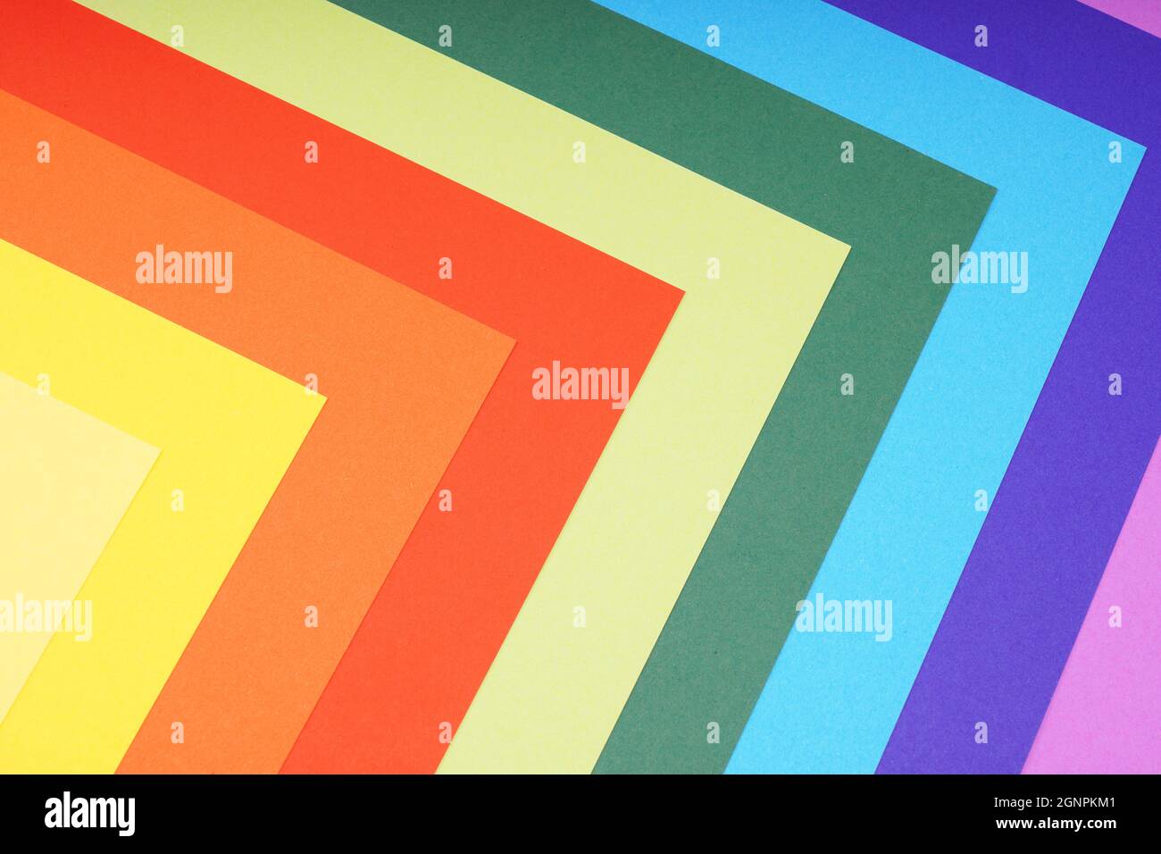 rainbow colored paper background with angular pattern Stock Photo - Alamy