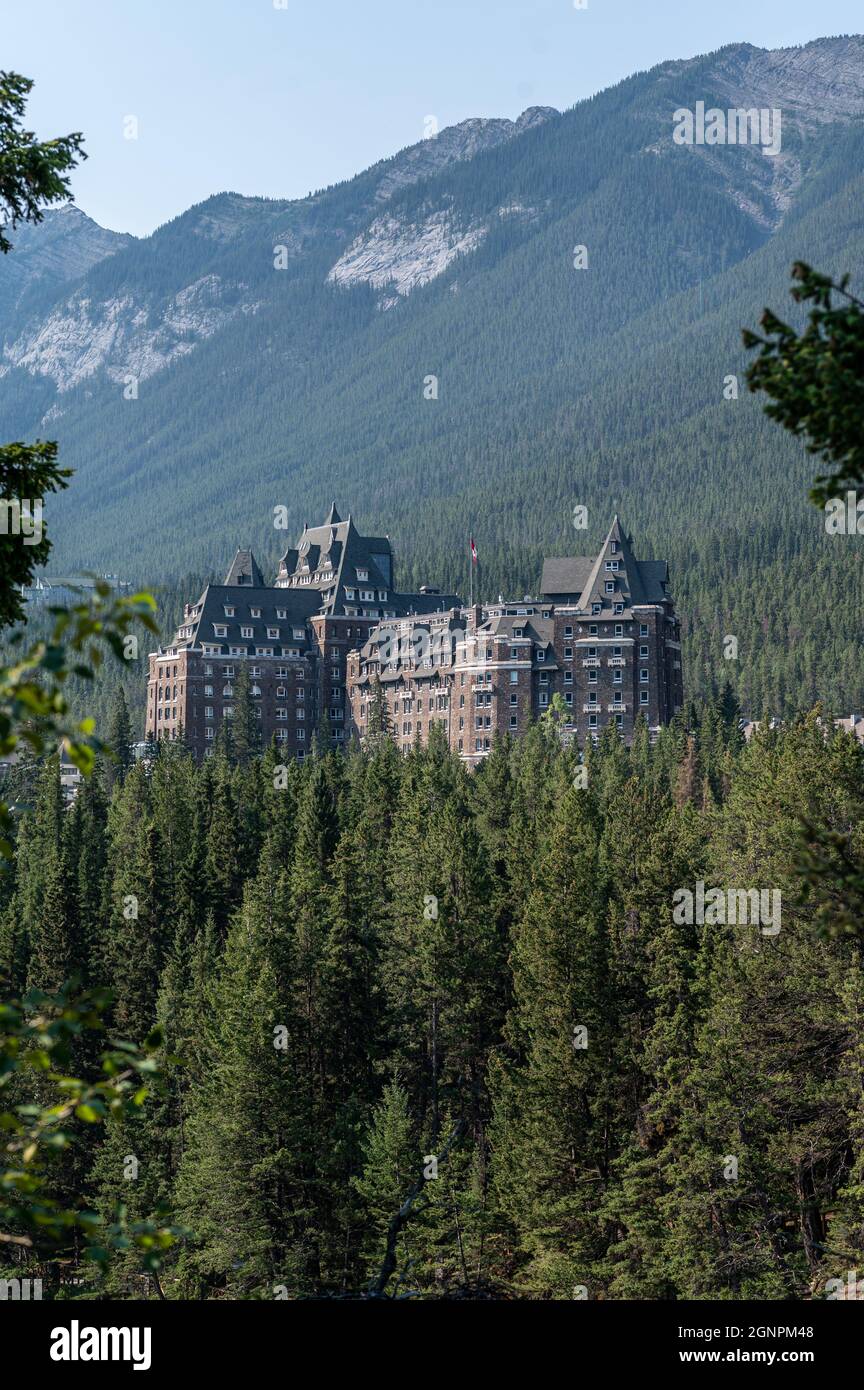 Vertical shot of the Fairmont Banff Springs hotel surrounded by ...