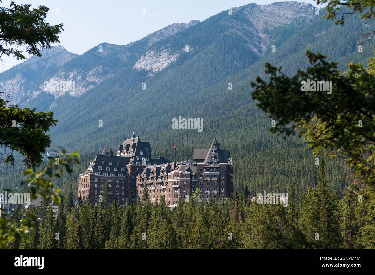 View of the Fairmont Banff Springs hotel surrounded by beautiful nature ...