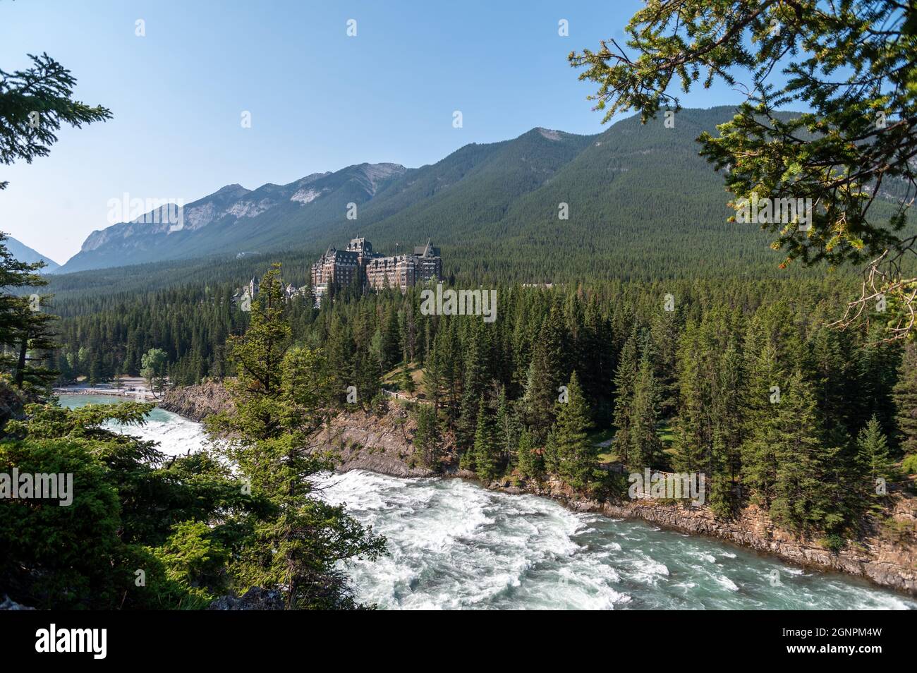 View of the Fairmont Banff Springs hotel surrounded by beautiful nature ...