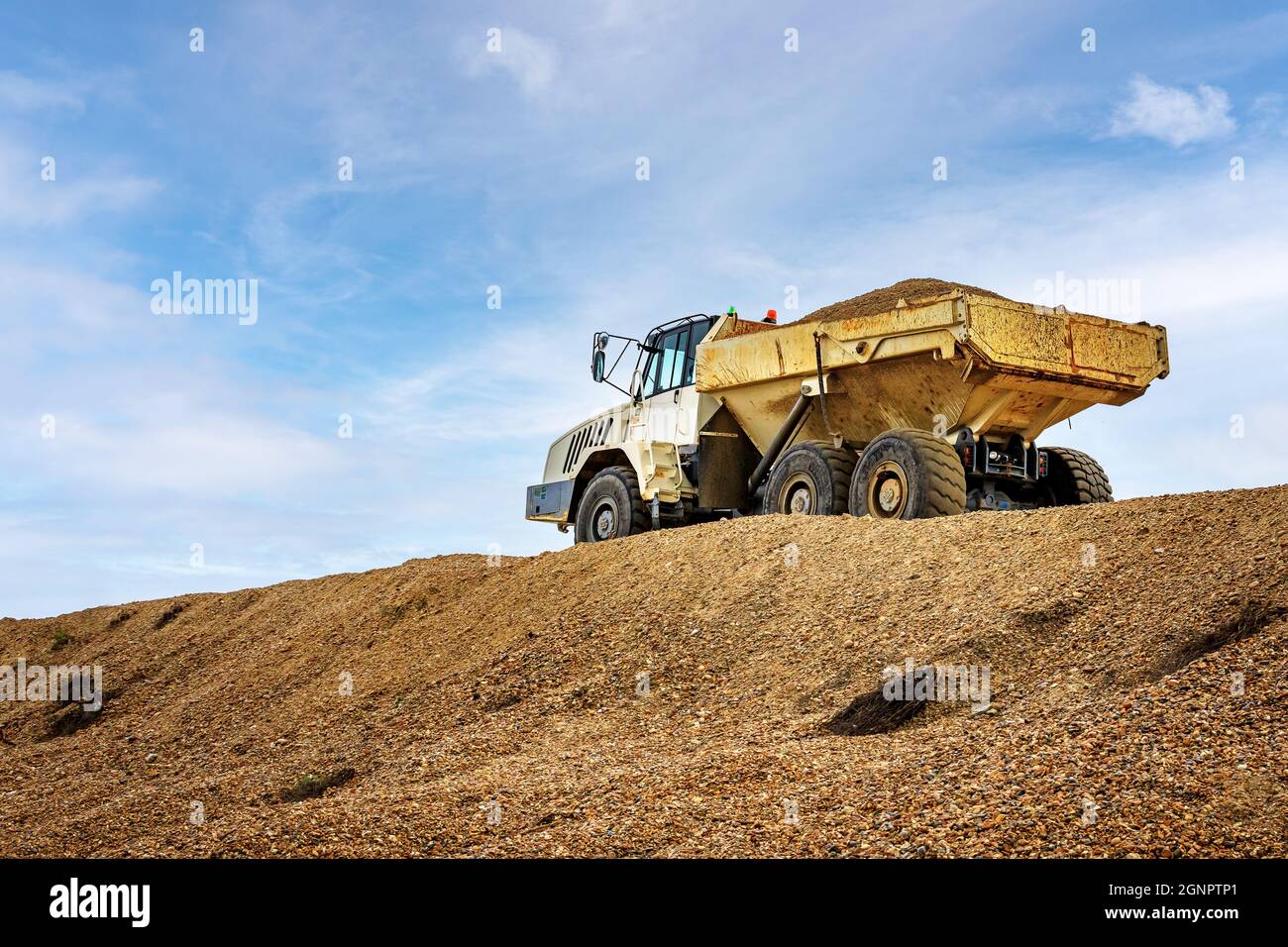 Articulated Dump Truck with load of shingle aggregate Stock Photo Alamy