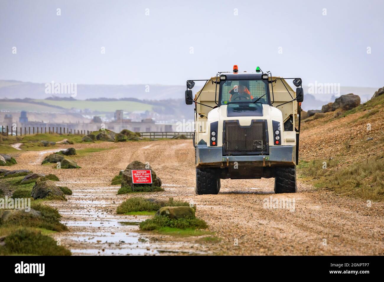 Articulated Dump Truck with load of shingle aggregate Stock Photo
