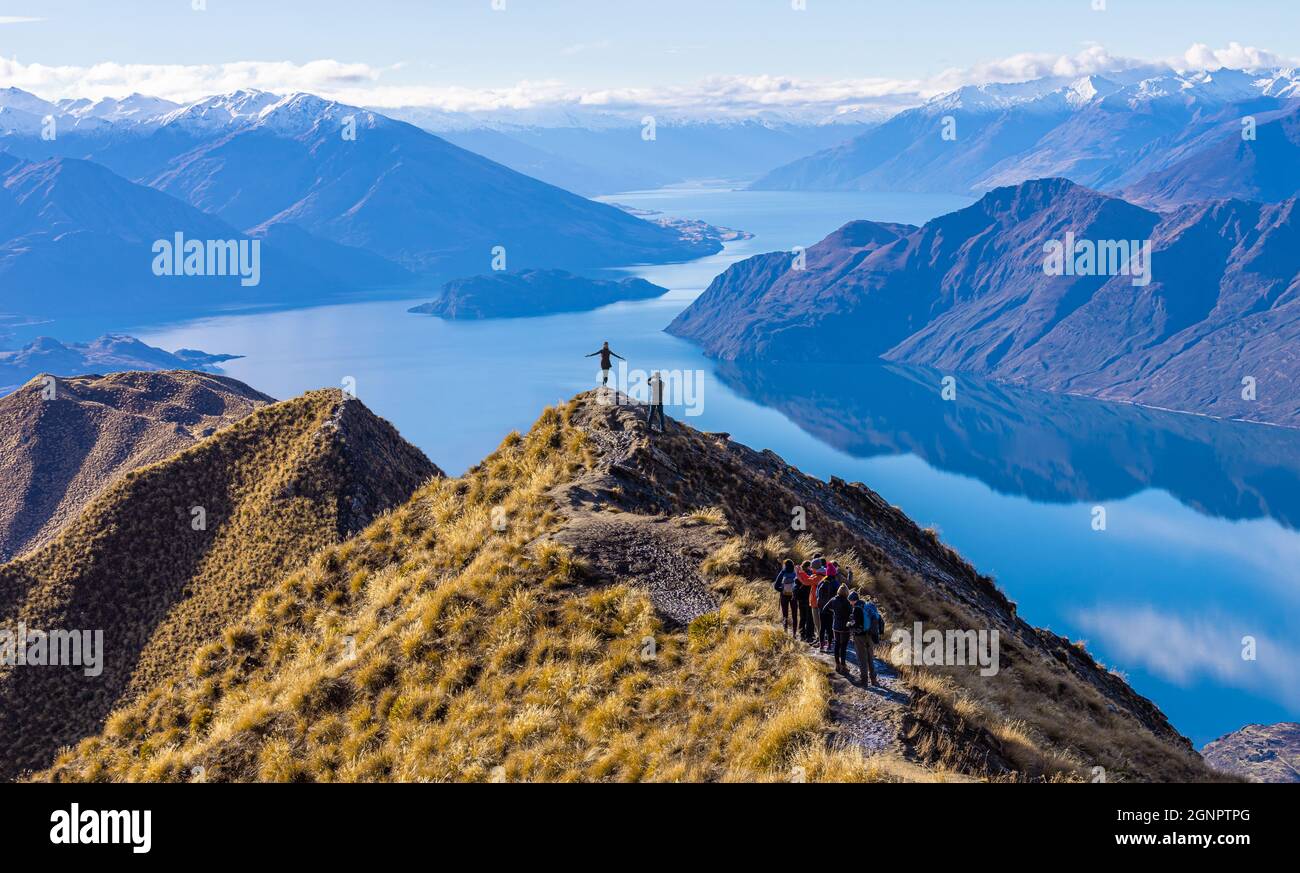 Asian tourists taking photo at Roy's Peak Lake Wanaka New Zealand Stock Photo