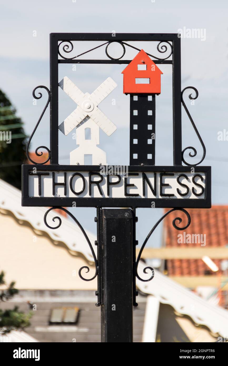 Thorpeness Village Sign showing the Windmill and House in the Clouds Suffolk England Stock Photo