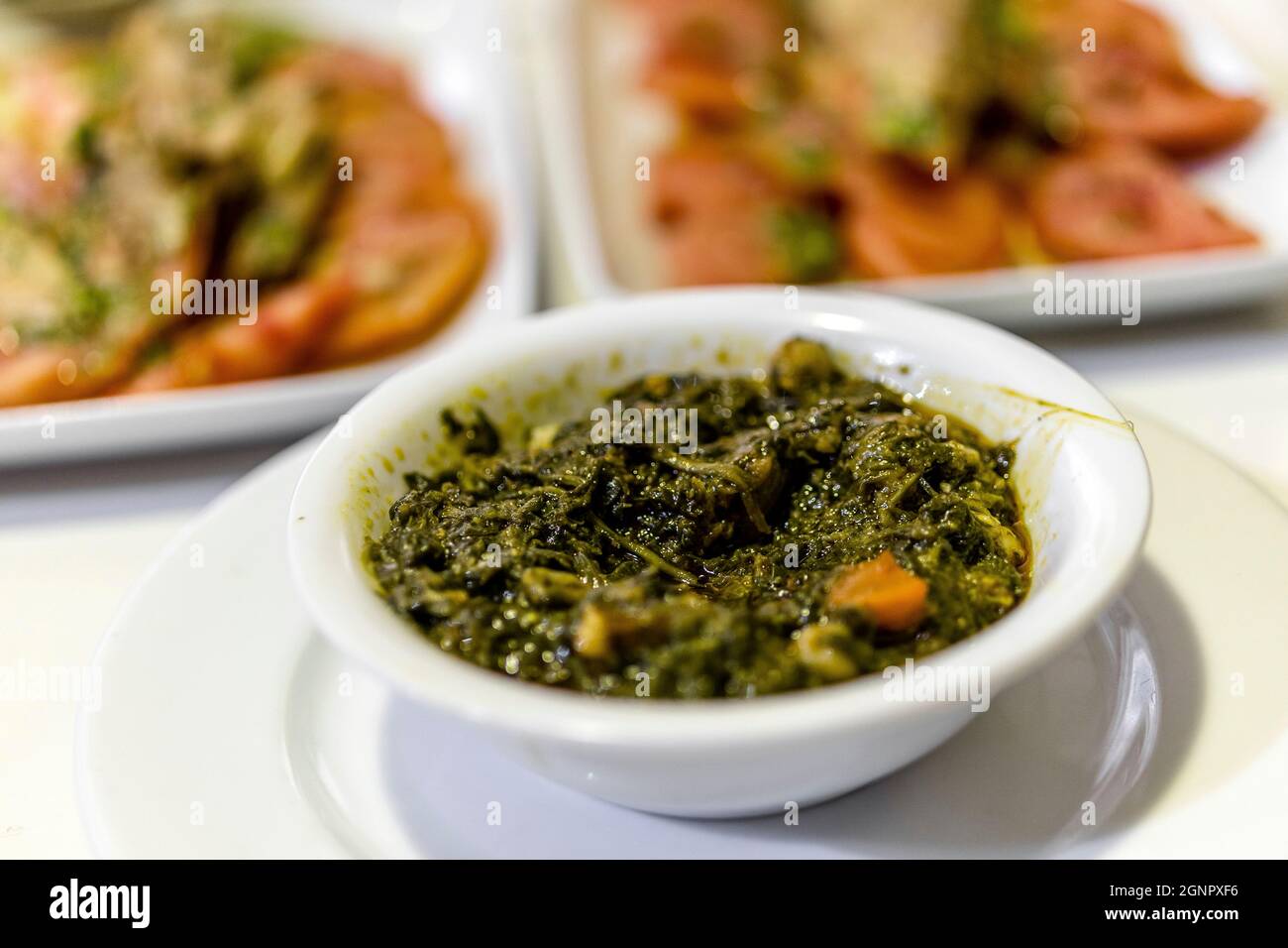 Spinach with carrot and olive oil served as tapas in Seville, Andalusia, Spain Stock Photo