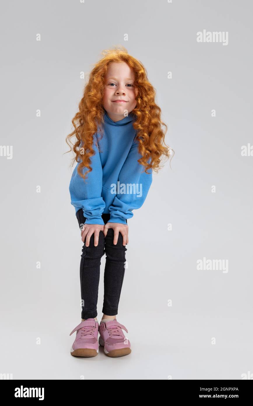 Portrait of little Caucasian girl, child posing looking at camera ...