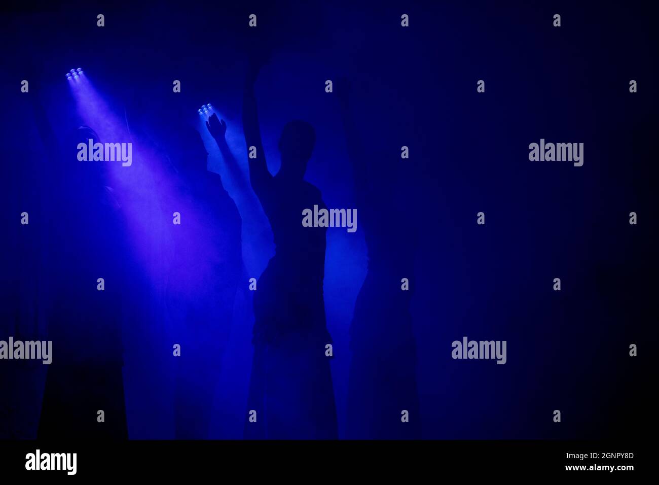 Spanish Flamenco dancer silhouette over dark blue background. Space for your design. Stock Photo