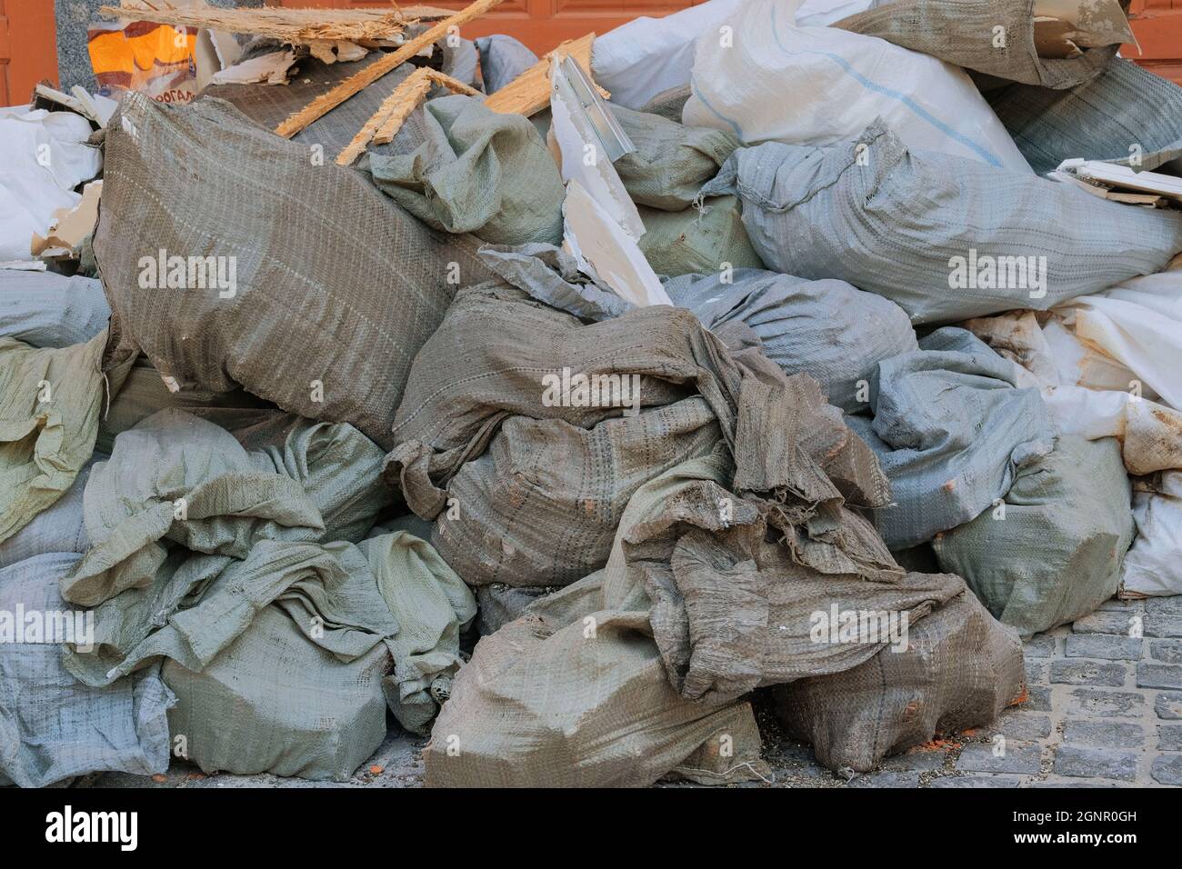 Construction garbage after building repair in bags. Removal of debris
