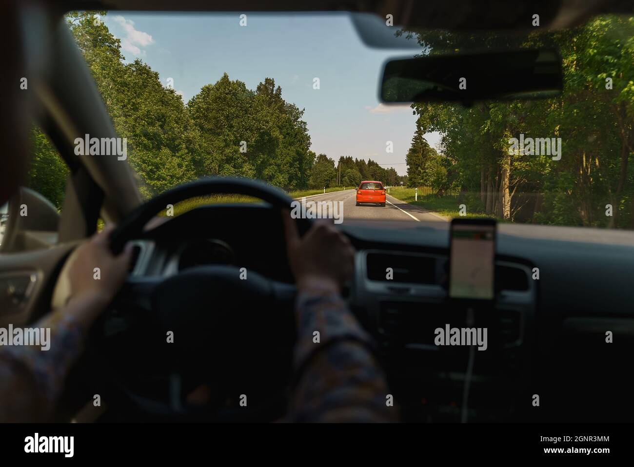 Woman driving a car in summer time Stock Photo - Alamy