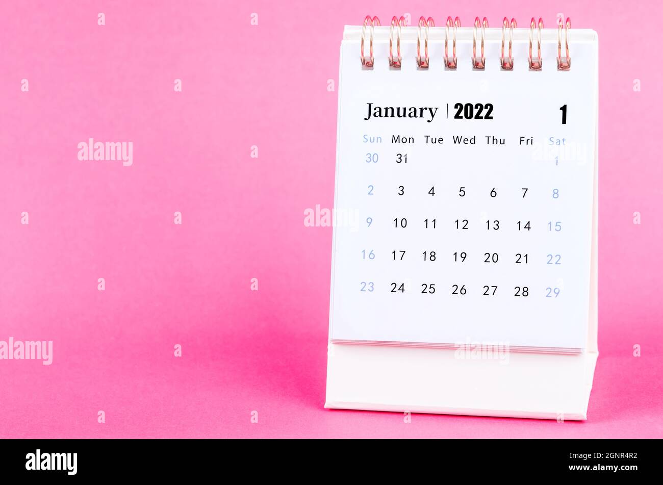 January 2022 Desk Calendar With Pink Alarm Clock Stock Photo - Alamy