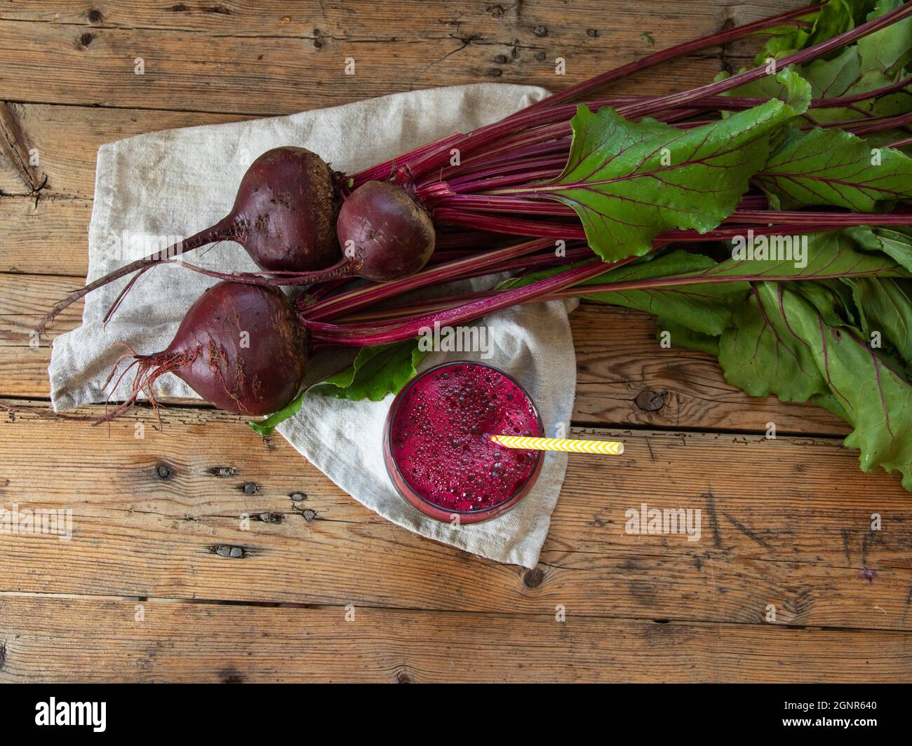 Fresh smoothie squeezed  beetroot juice in a glass on a wooden surface  Healthy eating, detox, dieting and vegetarian concept. Stock Photo