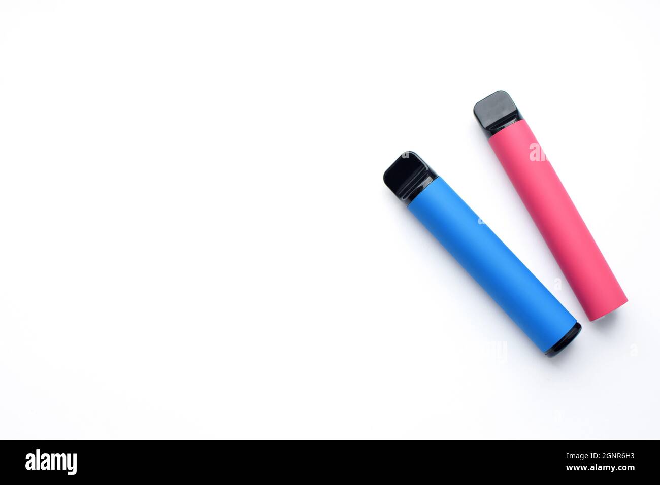 Two electronic cigarettes on a white background. Place for your text. Stock Photo