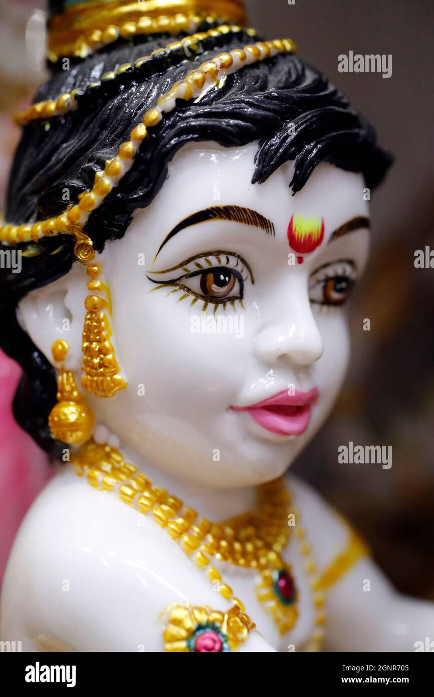 Religious hindu god statues for sale in spiritual shop. Figurines of Lord Krishna baby. Dubai