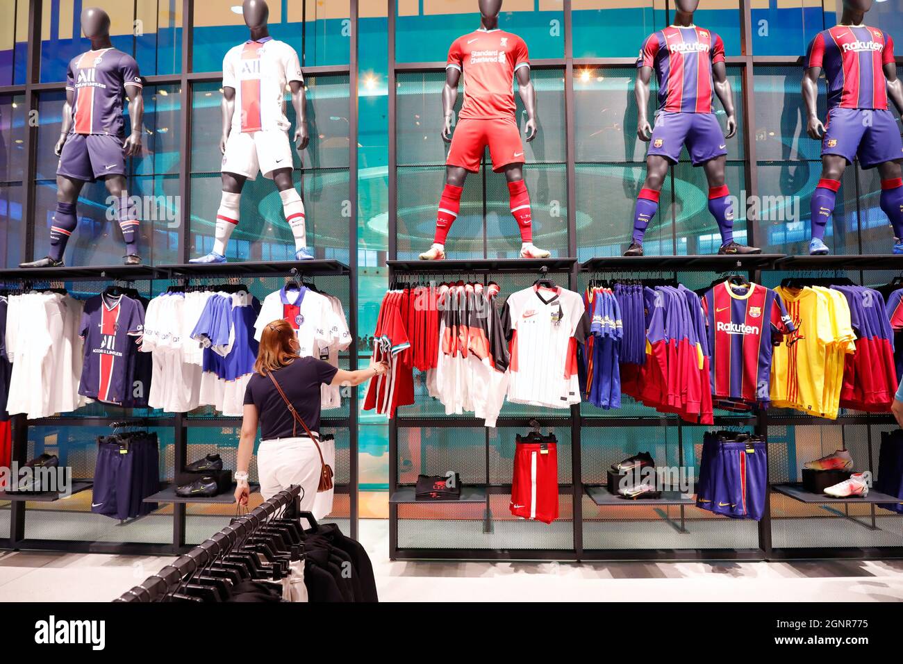 Dubai Mall, the largest mall in the world with 1200 shops, part of the Burj Khalifa complex. Nike sportswear store. Soccer shirts. Dubai. U Stock Photo - Alamy