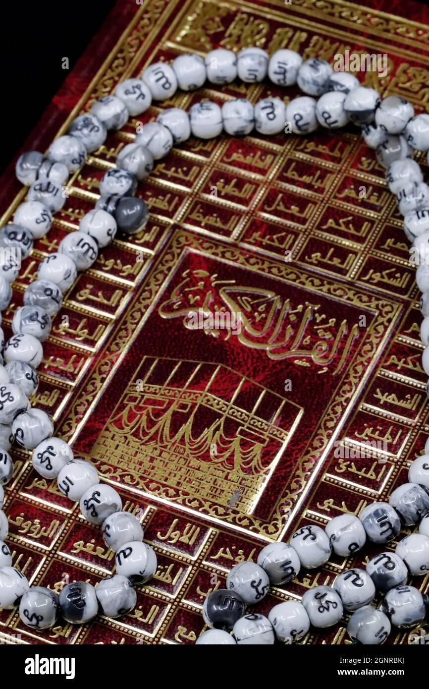 Cover of the Holy Quran and Tasbih ( muslim prayer beads ). Faith anbd religion. 99 Names of