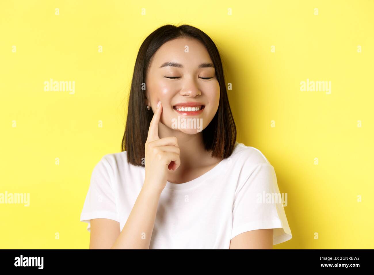 Beauty and skincare. Close up of young asian woman with short dark hair ...