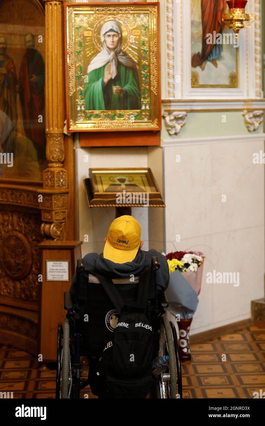 Orthodox mass in Transfiguration church, Chisinau, Moldova. Disabled person Stock Photo