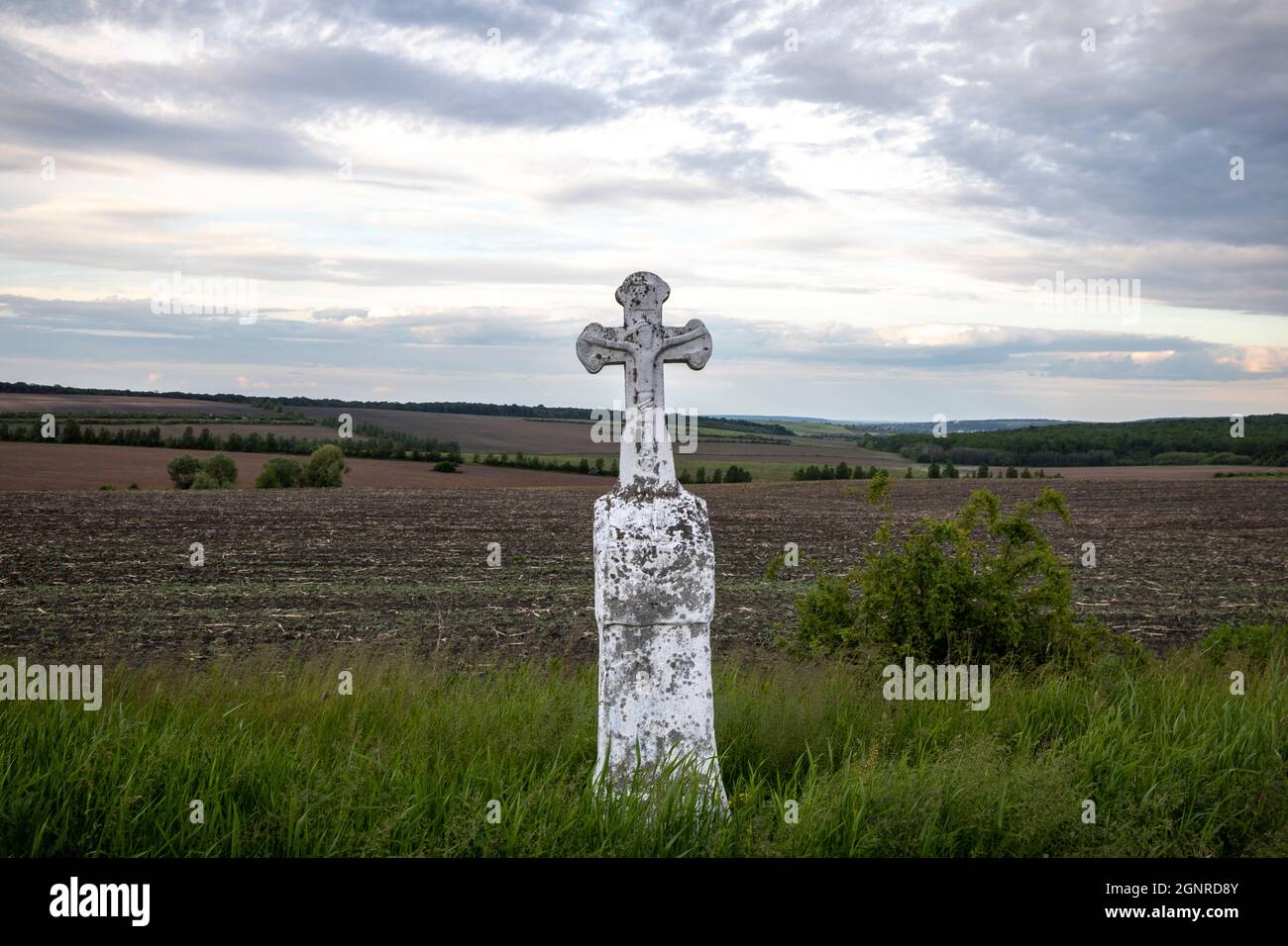 Cross along a road in Moldova Stock Photo