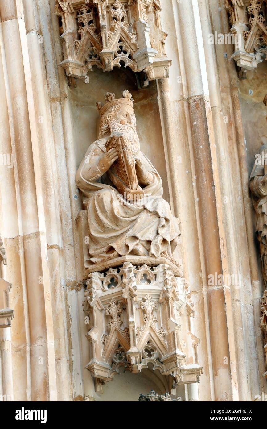 Batalha Monastery. Late Gothic architecture, intermingled with the Manueline style. Western portal. King David with playing the harp. Portugal. Stock Photo