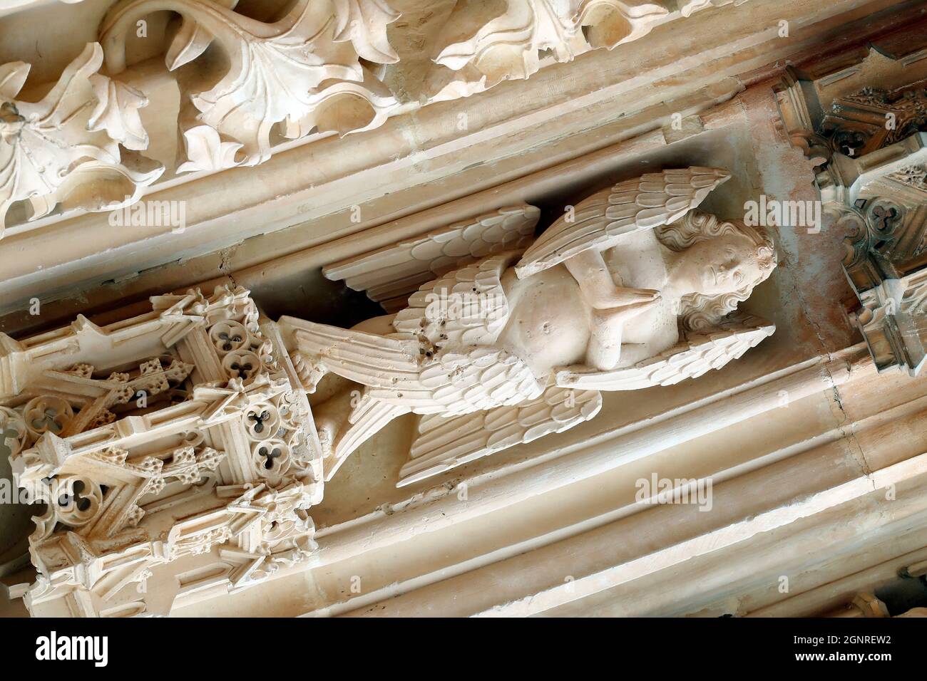 Batalha Monastery. Late Gothic architecture, intermingled with the Manueline style. Western portal. Angel.  Portugal. Stock Photo