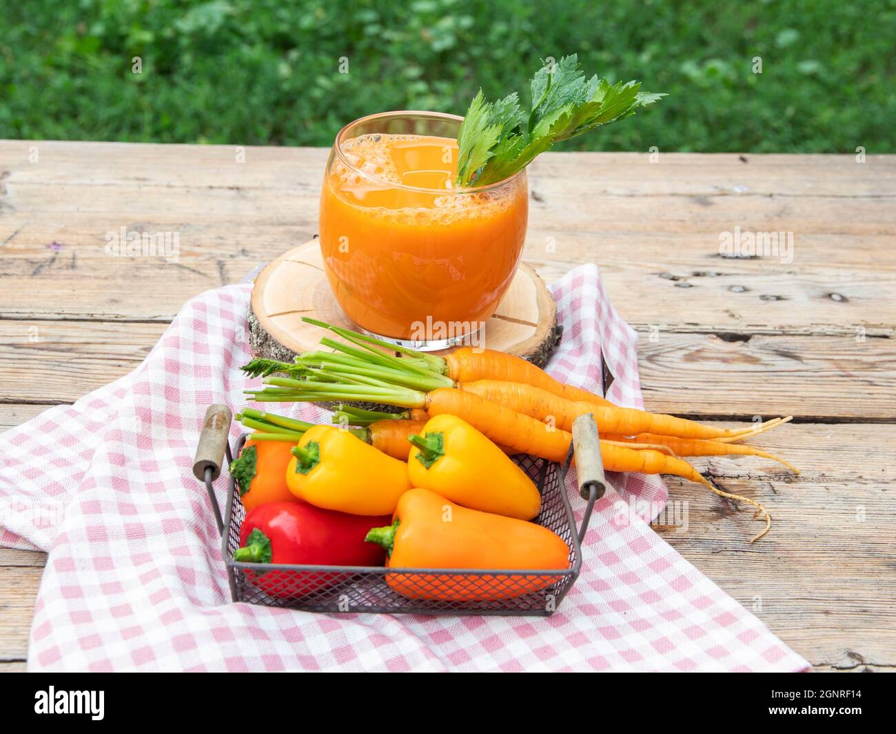 Fresh squeezed smoothie bell pepper, carrot, juice in a glass. Healthy eating, detox, dieting. outdoors Stock Photo