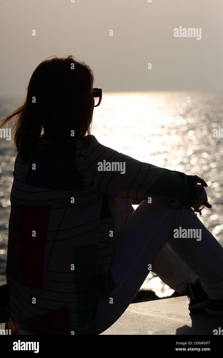 Sitting watching sunset hi-res stock photography and images - Alamy