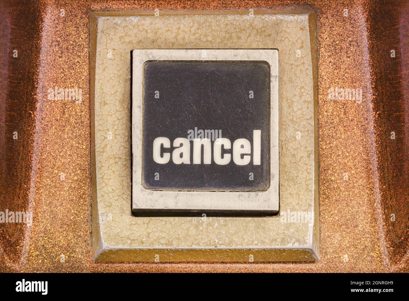 Retro styled image of a cancel push button on a vintage arcade game machine Stock Photo