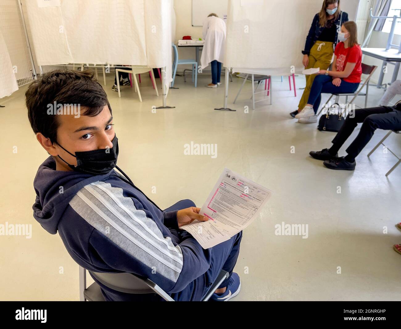 Teenager in a covid-19 vaccination center in Bernay, France Stock Photo